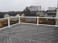 <b>Trex Transcend Island Mist deck boards in a Herringbone layout with White Washington Vinyl Railing and Black Round Aluminum Balusters in Eldersburg, MD 1</b>